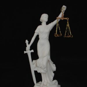 Statue of Themis Goddess of Justice with her name written in Latin characters in White color