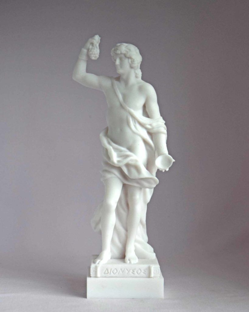 The statue of Dionysus holding a bunch of grapes and a container in White color.