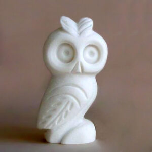 A micrography statue of a small Owl in White color