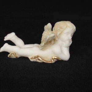 The statue of a Lying angel holds his head in Patina color