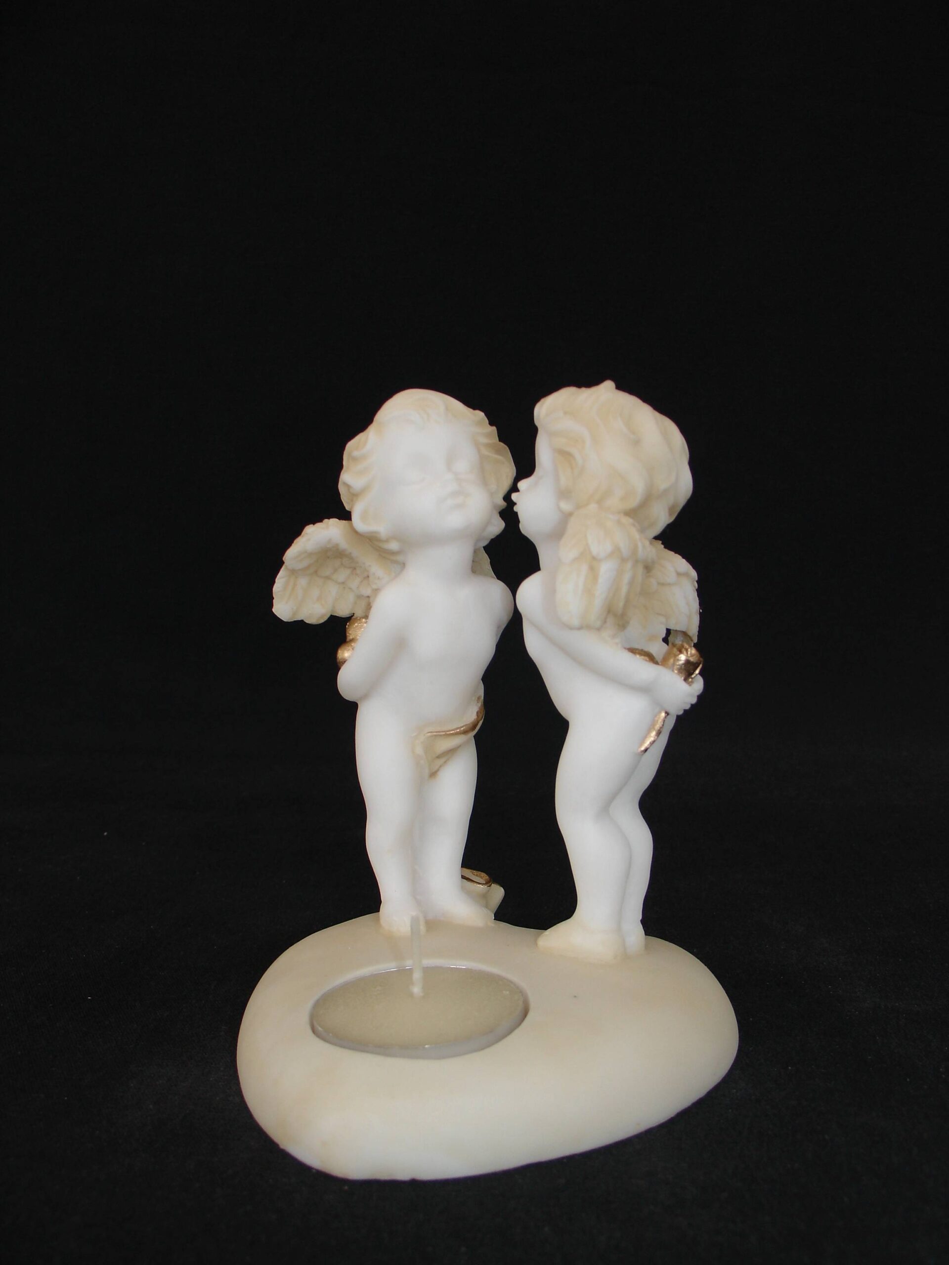 3-642-p-front A statue of two Angels standing on a heart shape candle type 3 in Patina color