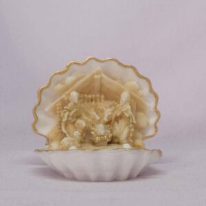 The statue of a manger placed in a shell in Patina color