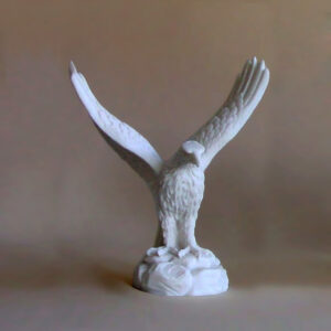 The statue of an Eagle with the wings wide open in White color