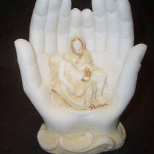 The statue of Virgin Mary holding the dead body of Christ inside hands in Patina color