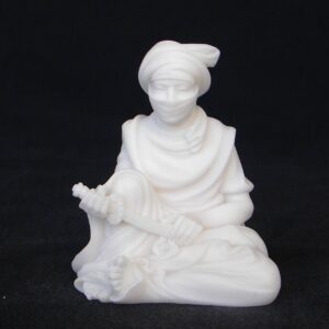 Greek statue of Arab man holding knife while sitting down in White color