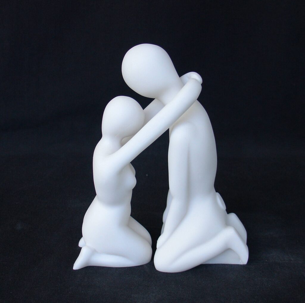 The statue of a couple depicted in modern style in White color